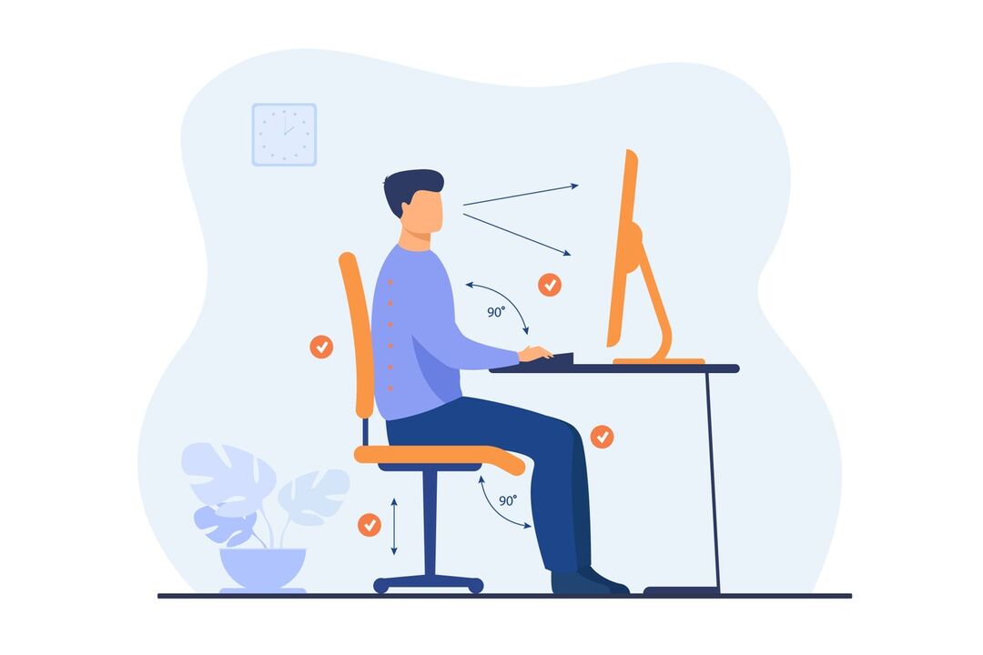 Homem trabalhando em um computador de forma ergonômica.